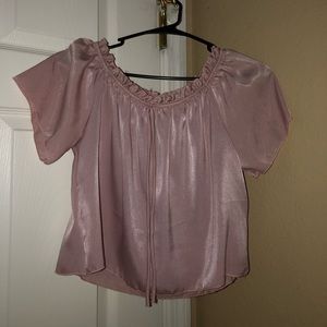 Off the shoulder baby pink silk type of top